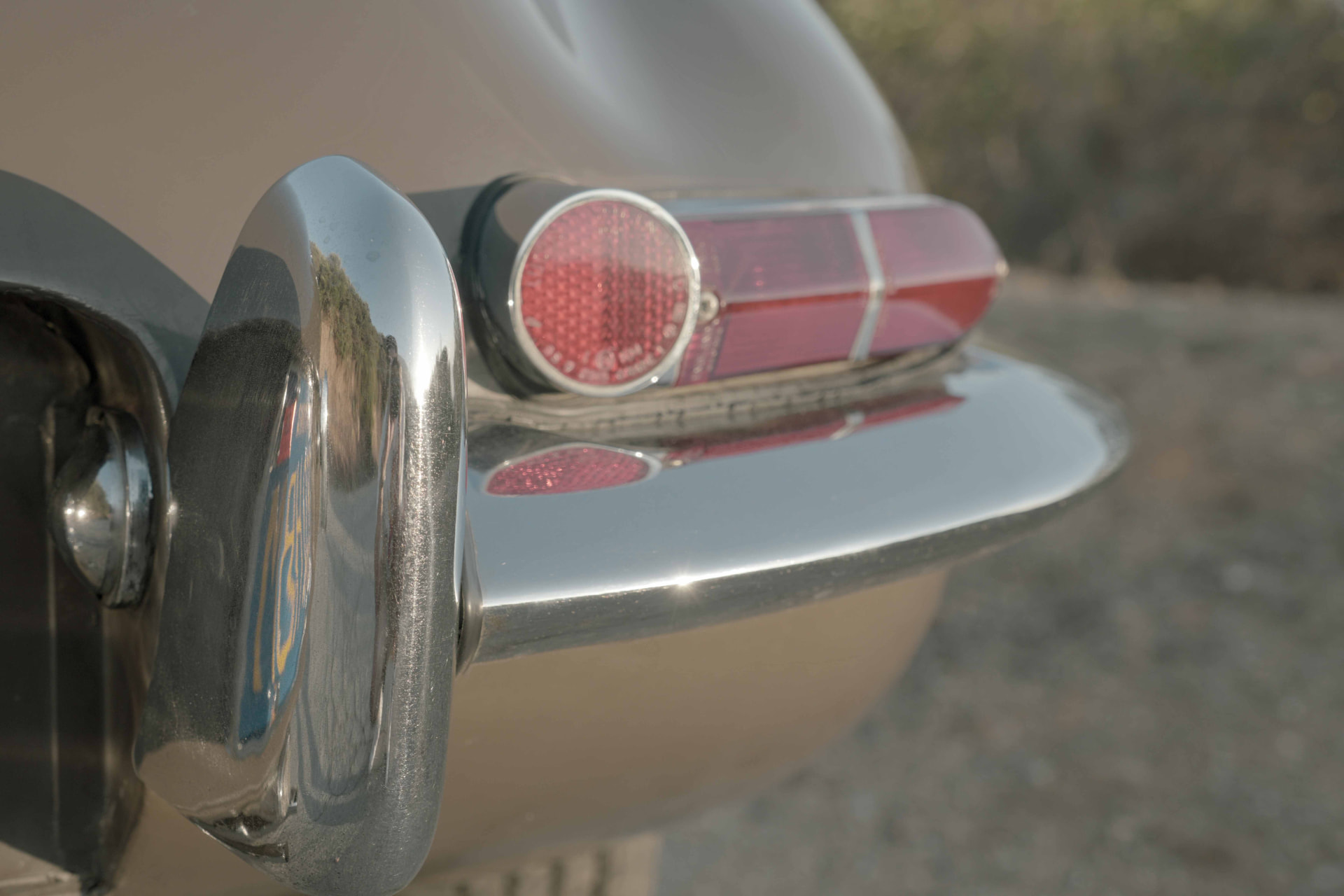 Jaguar E-Type tail light and chrome bumper detail